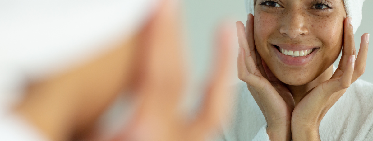 Woman Looking in Mirror at Beauty Treatment