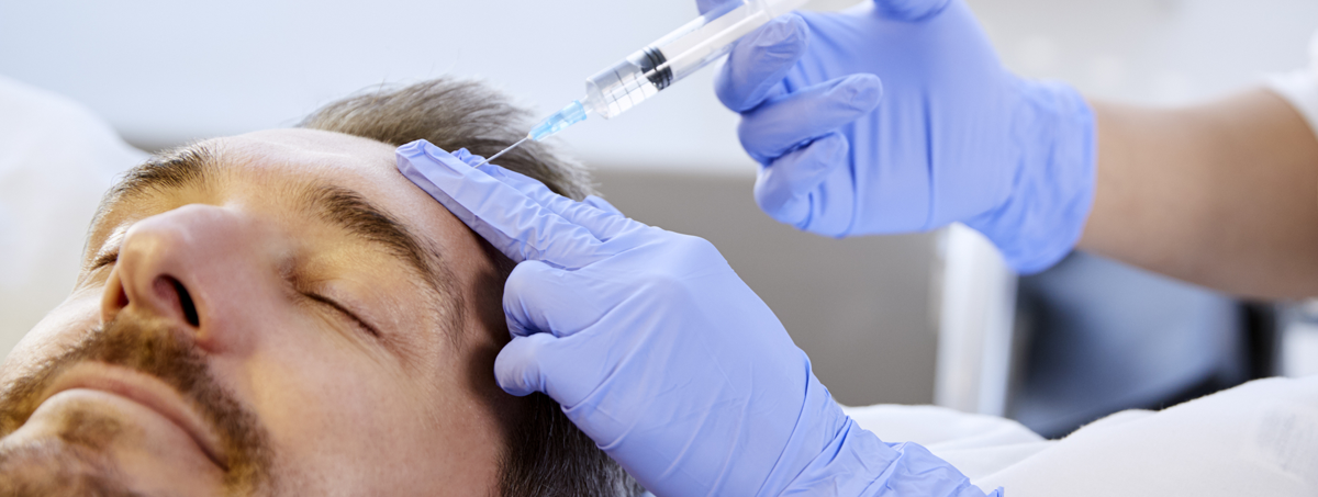 Man Receiving Botox Treatment by Nurse